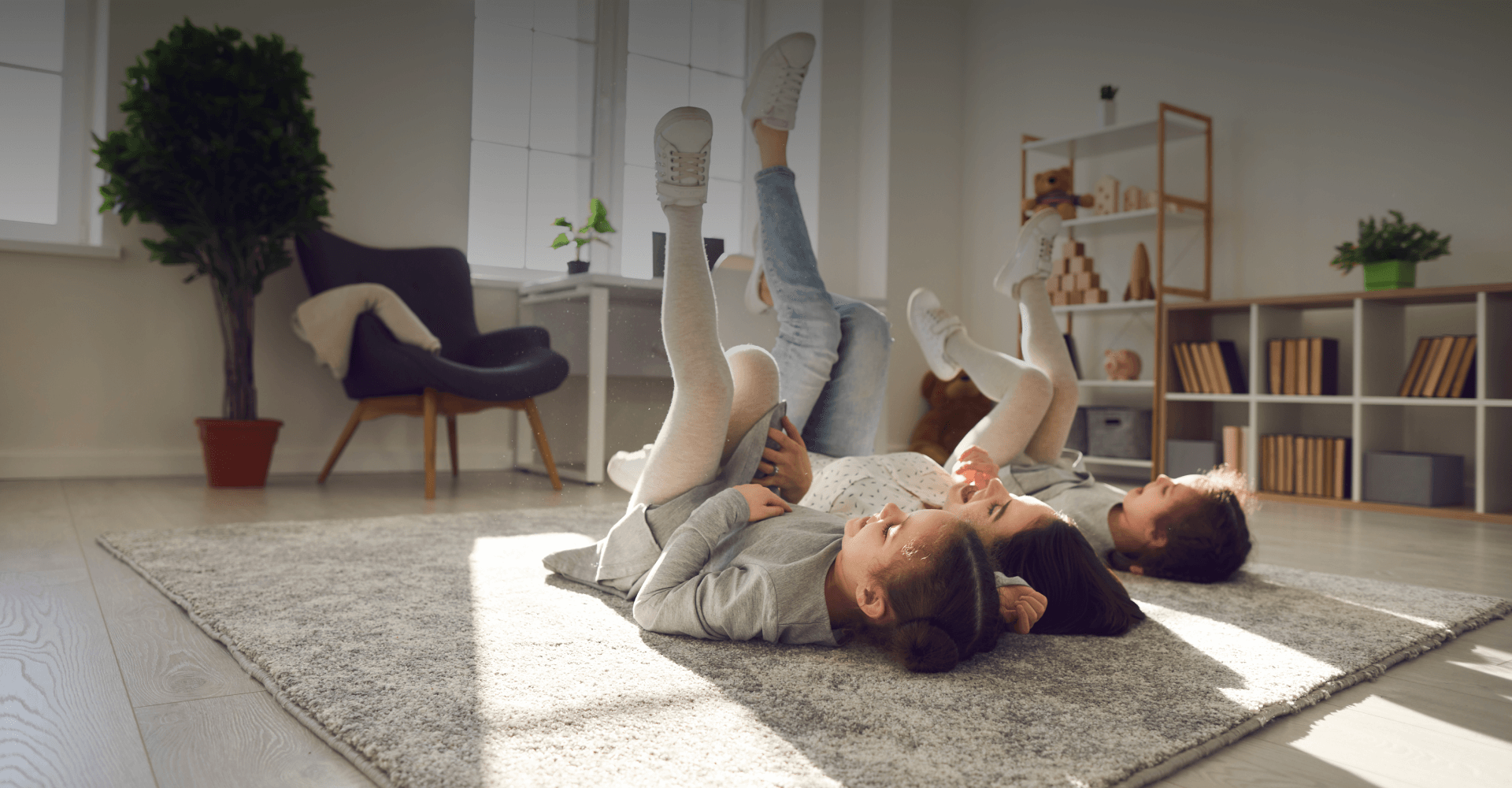 kids playing on newly installed Carpet One vinyl flooring in playroom