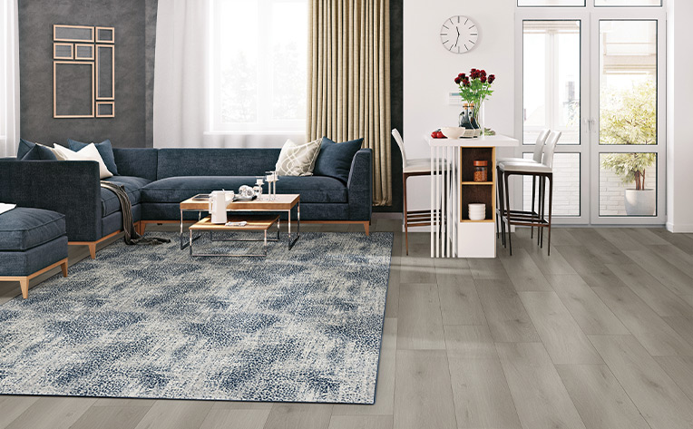 blue patterned area rug in open concept living room